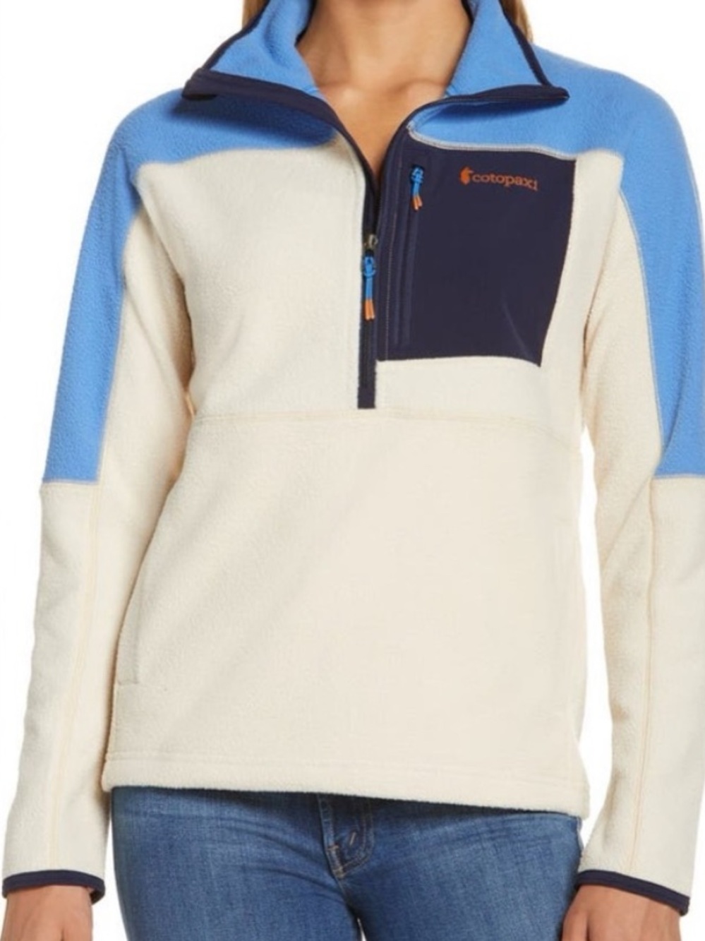 Cotopaxi Cream Fleece Pullover with Sky Blue Shoulders and Navy Chest Pocket